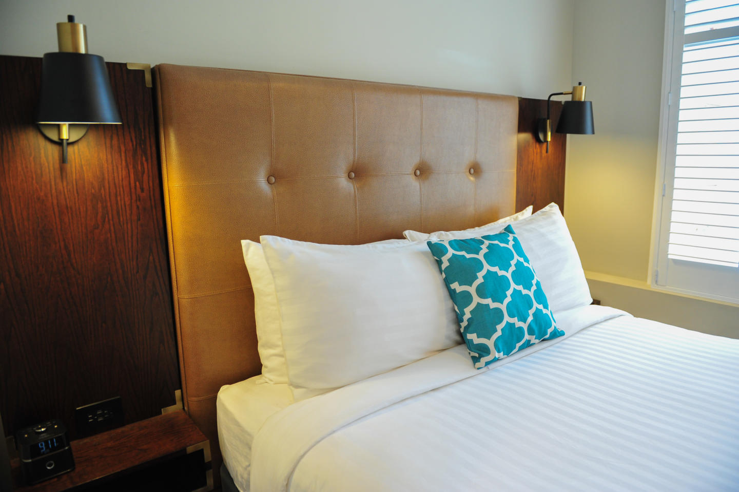 Hotel guest room with bed and headboard built by Morgan Li 