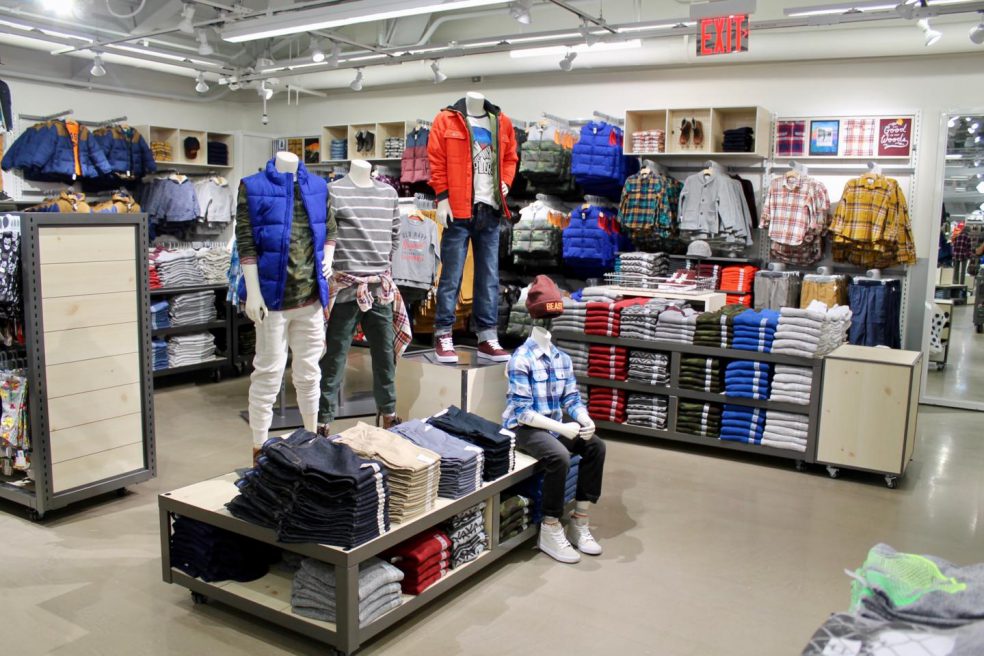 Men's Apparel section with custom retail fixtures by Morgan Li