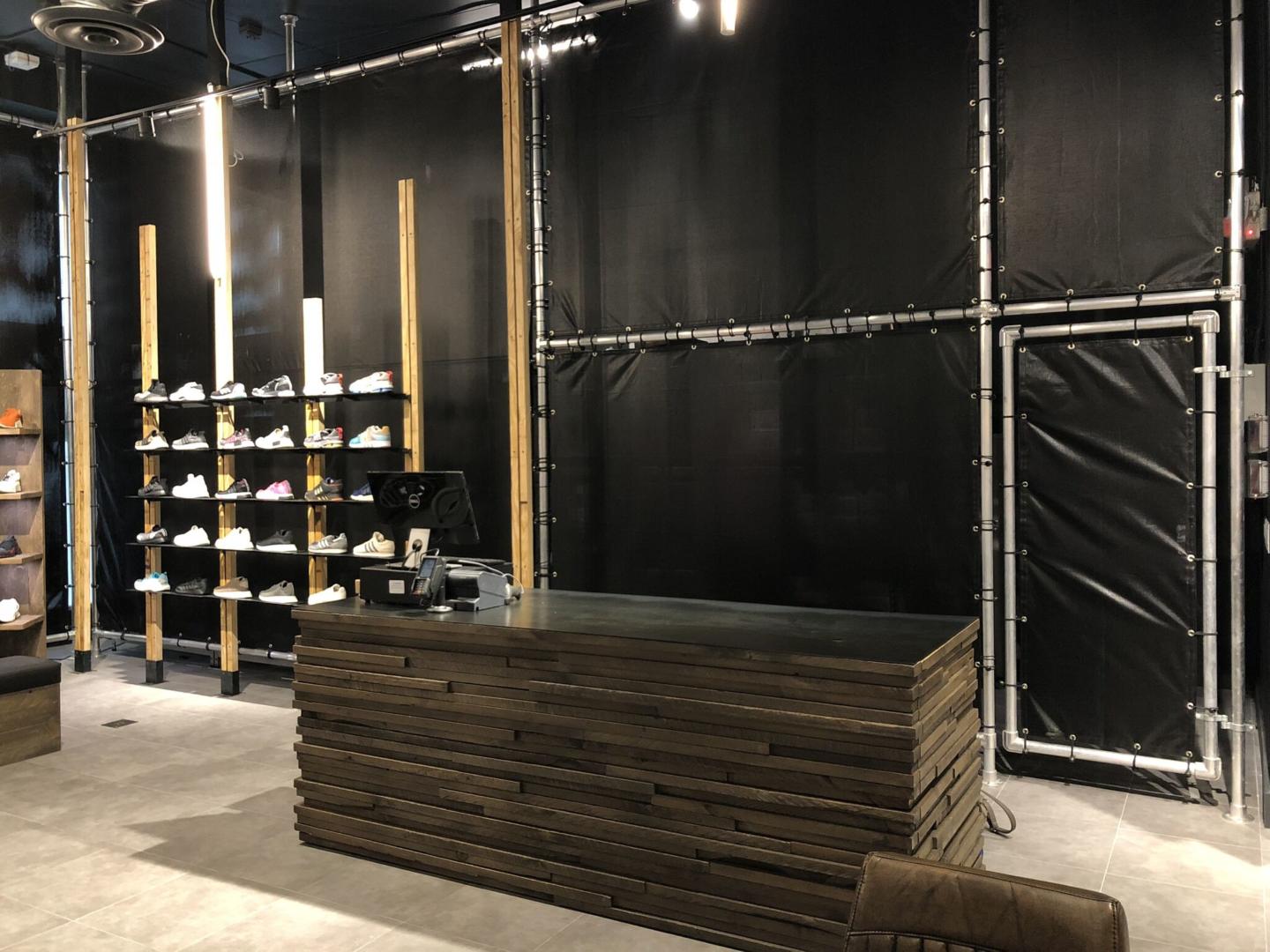 Cashwrap with construction wood built by Morgan Li for Adidas 