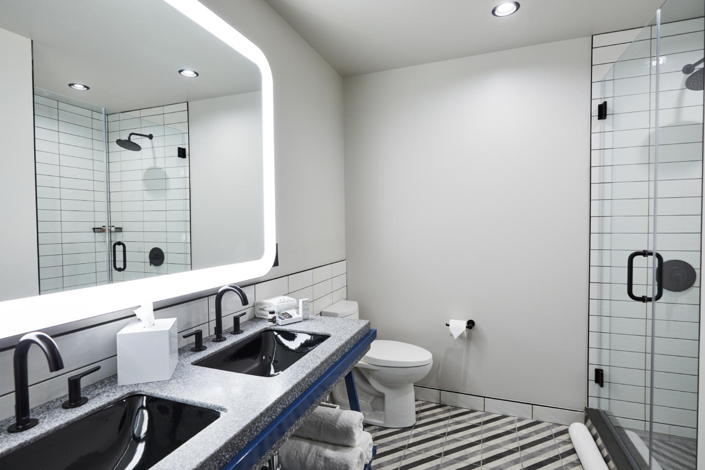 Bathroom vanity with two sinks installed at boutique hotel. 