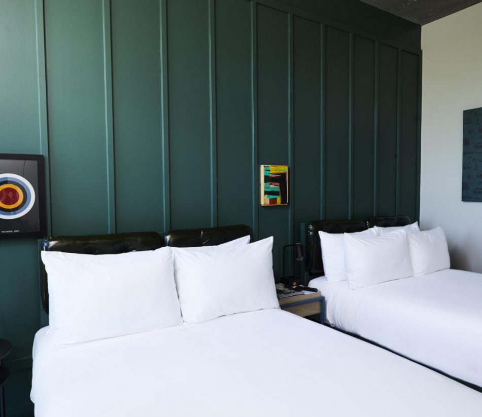 Two twin beds in boutique hotel guestroom by custom manufacturer Morgan Li