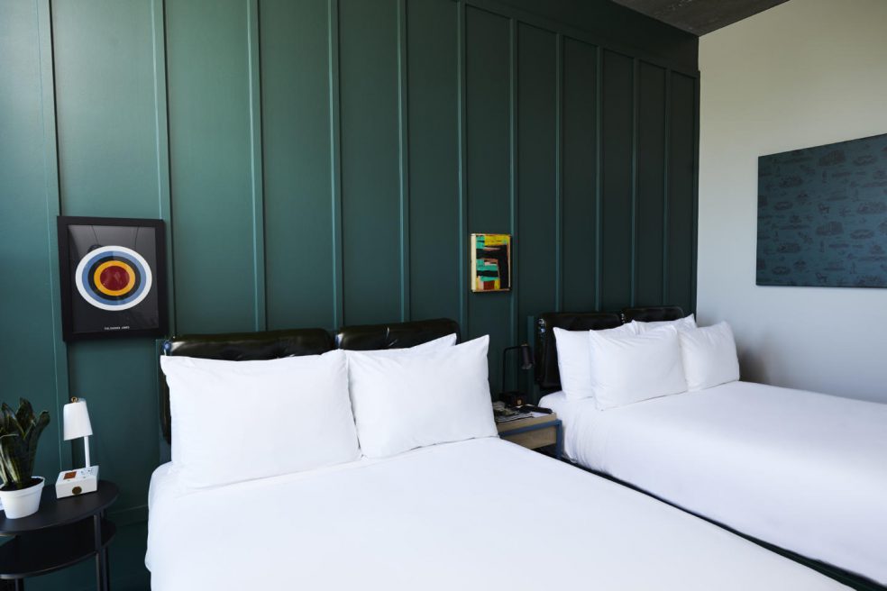 Two twin beds in boutique hotel guestroom by custom manufacturer Morgan Li