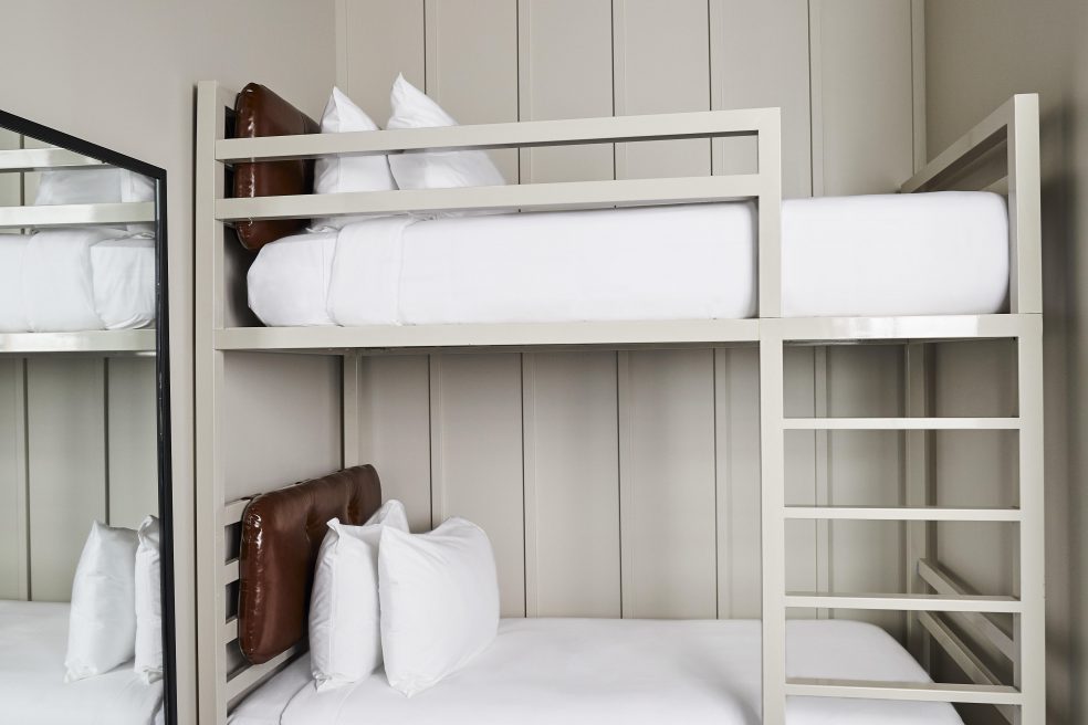 White bunk beds by custom manufacturer Morgan Li at boutique hotel