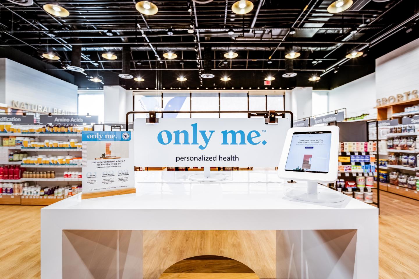 Retail display table with tablet and graphics at Vitamin Shoppe