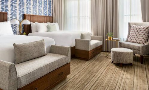 Hotel Northland guest room with beds, headboards, casegoods, and furniture by Morgan Li