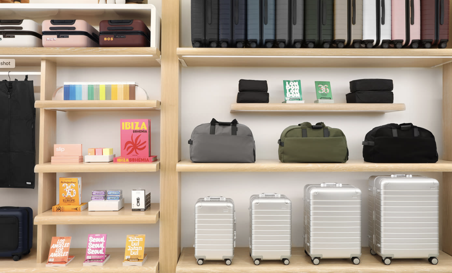 Suitcases and luggage on custom retail display by Morgan Li