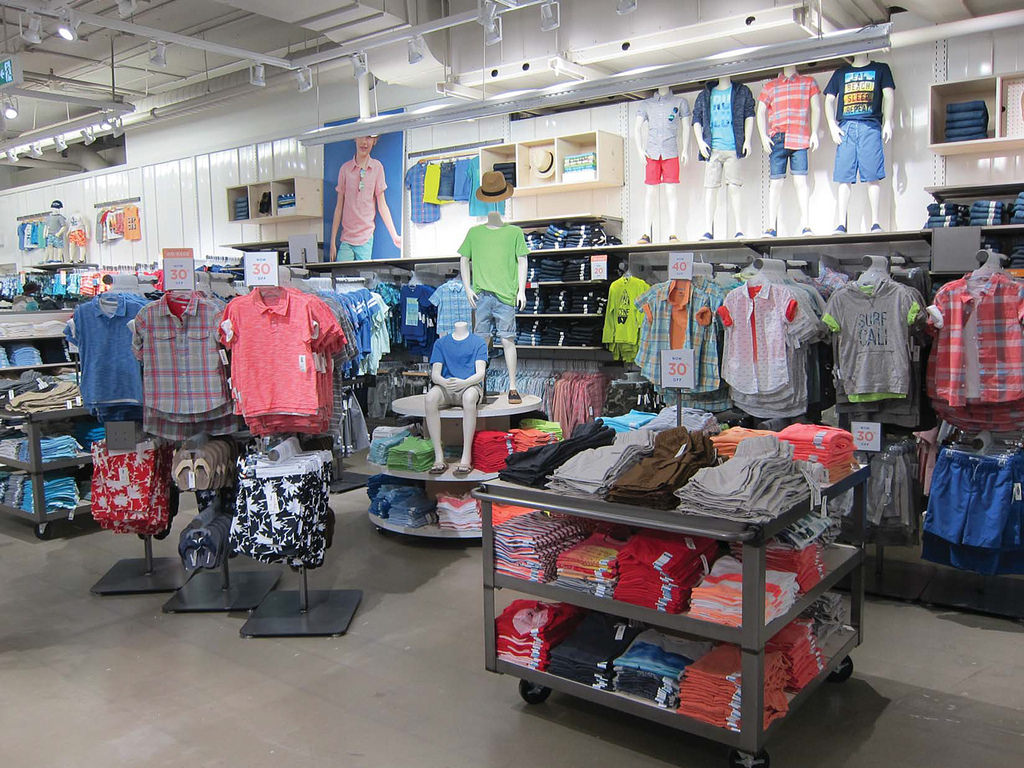 Rolling cart, floor displays, and apparel fixtures at Old Navy by Morgan Li