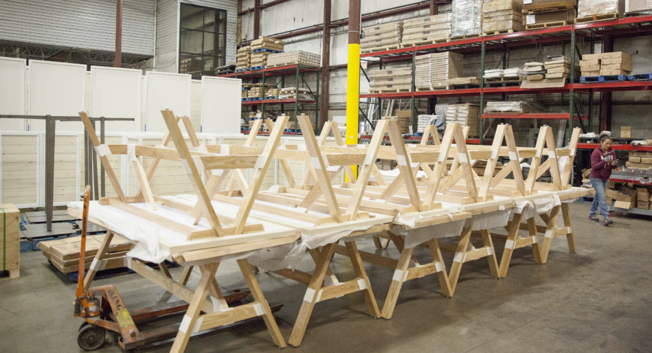 Finished wooden display tables for specialty retailer