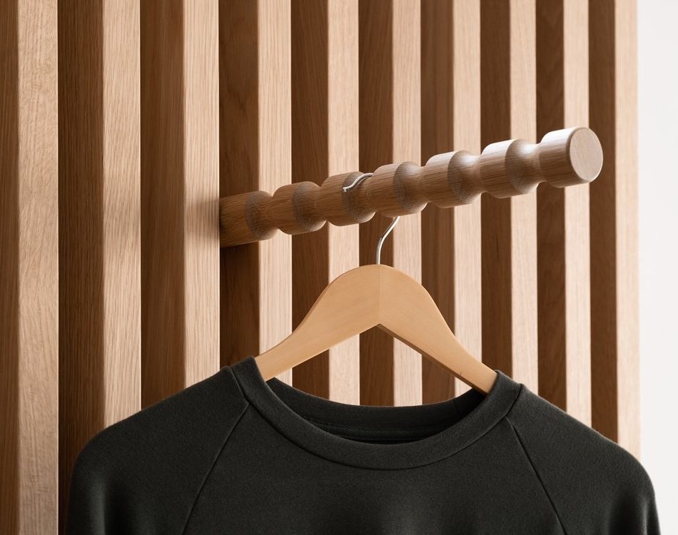 T-shirt and hanger on custom wood slat perimeter display by Morgan Li