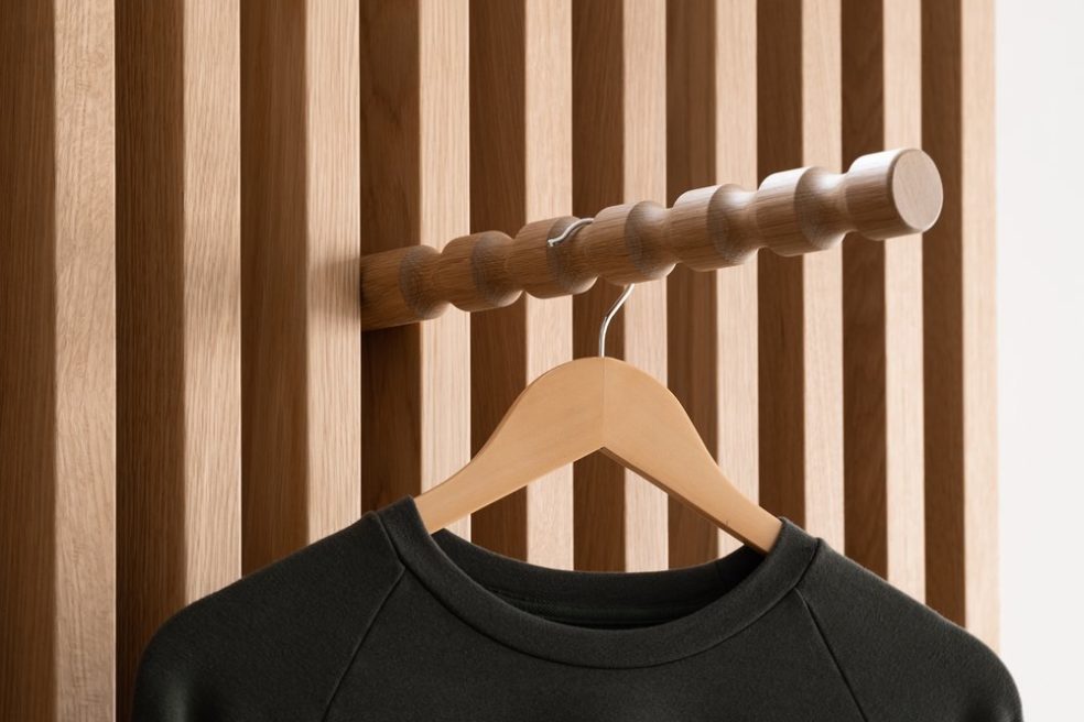 T-shirt and hanger on custom wood slat perimeter display by Morgan Li