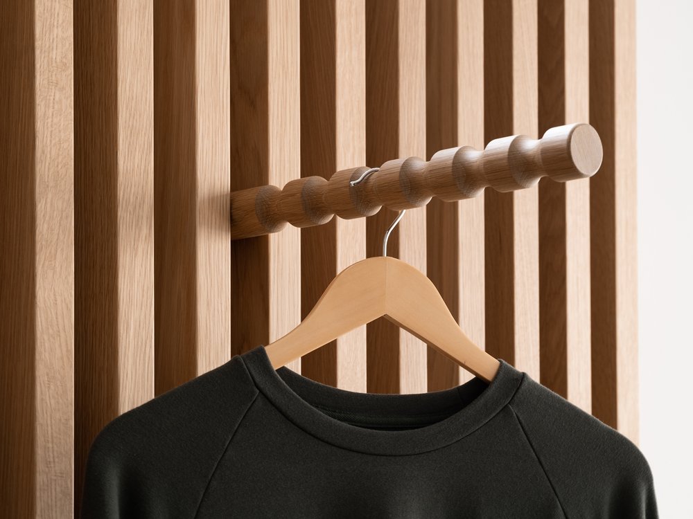 T-shirt and hanger on custom wood slat perimeter display by Morgan Li